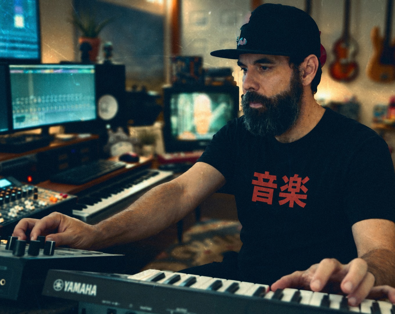 Taylor Jordan working with synthesizers in the studio